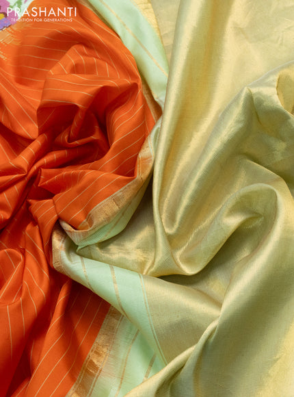 Pure gadwal silk saree orange and pista green with allover stripes pattern and embroided butta border