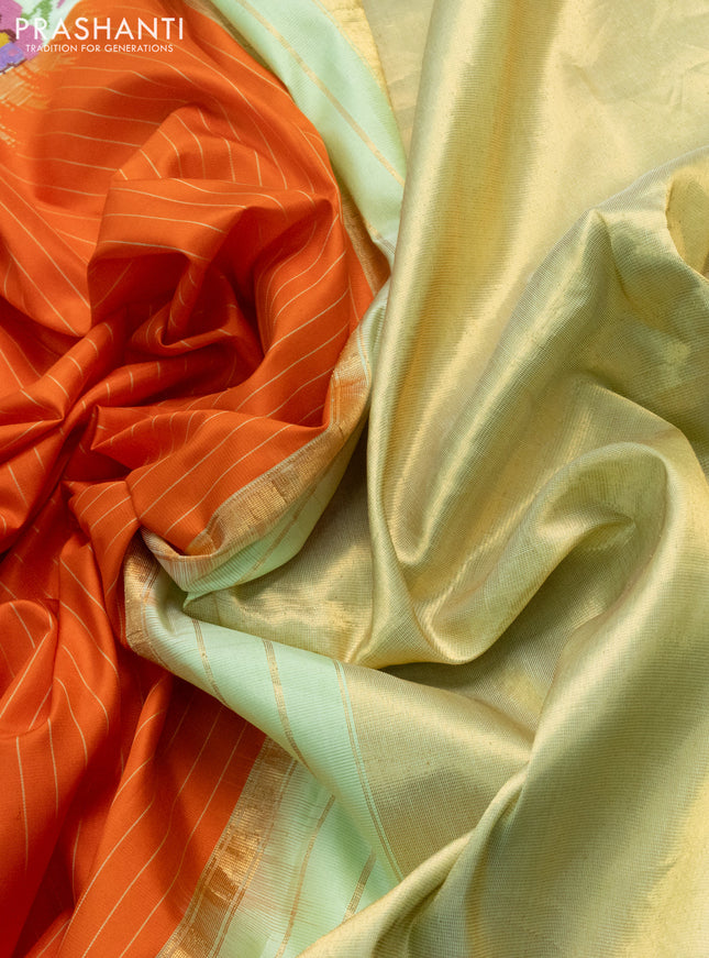 Pure gadwal silk saree orange and pista green with allover stripes pattern and embroided butta border