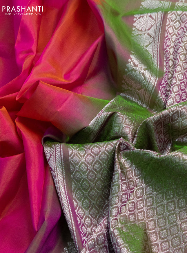Venkatagiri silk saree dual shade of pinkish orange and dual shade of green with plain body and rettapet silver zari woven border