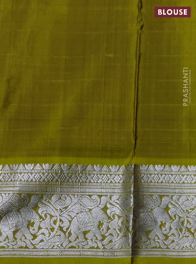 Venkatagiri silk saree purple and mehendi green with allover silver zari checks & temple buttas and elephant silver zari woven border