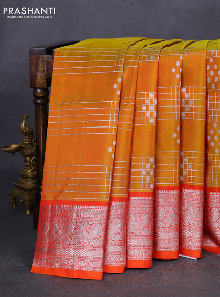 Venkatagiri silk saree dual shade of mustard yellow and orange with allover silver zari weaves and annam silver zari woven border