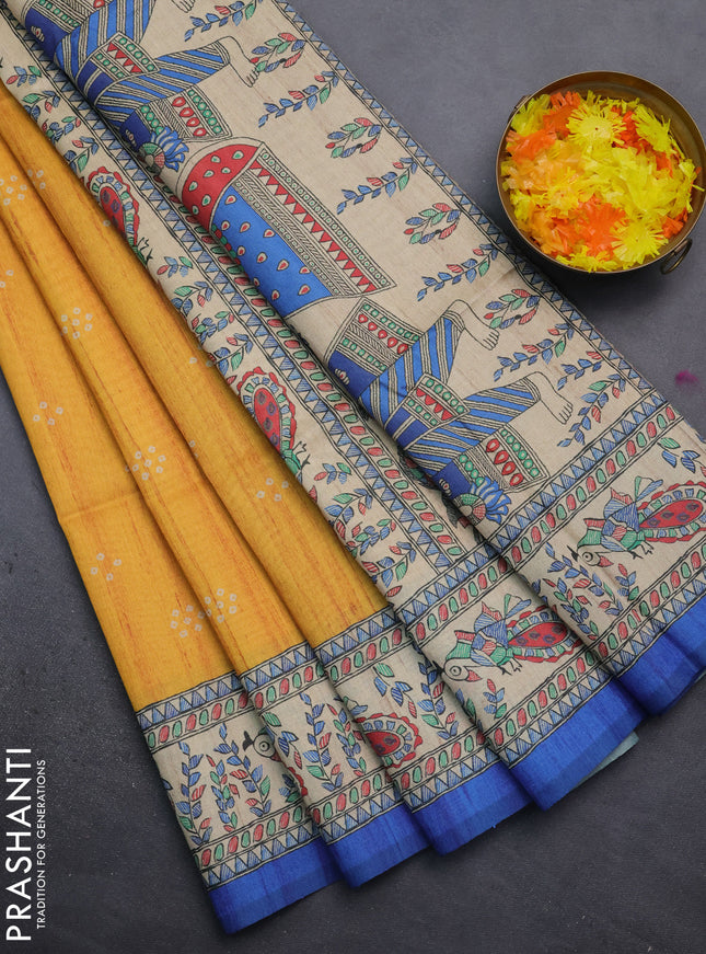 Semi tussar saree mustard yellow and blue with bandhini butta prints and madhubani printed pallu
