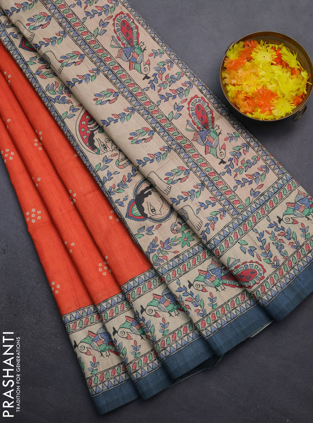 Semi tussar saree orange and beige with bandhini butta prints and madhubani printed pallu