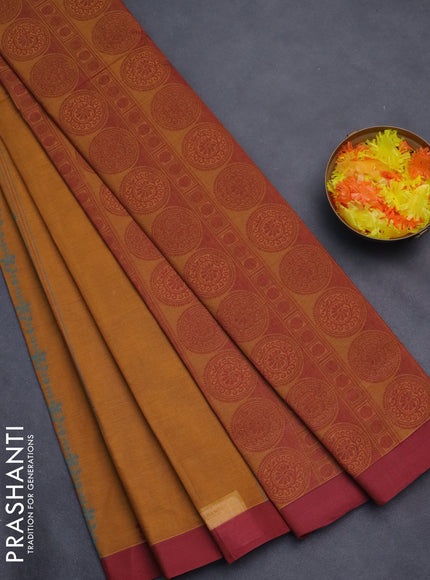 Nithyam cotton saree mustard and maroon with allover thread weaves and simple border