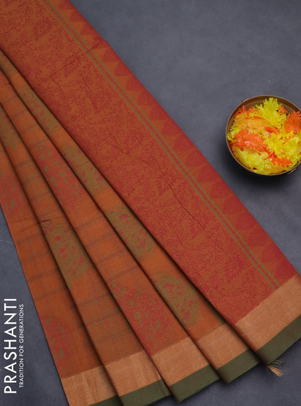 Nithyam cotton saree rust shade and green shade with allover thread checked pattern & buttas and zari woven border