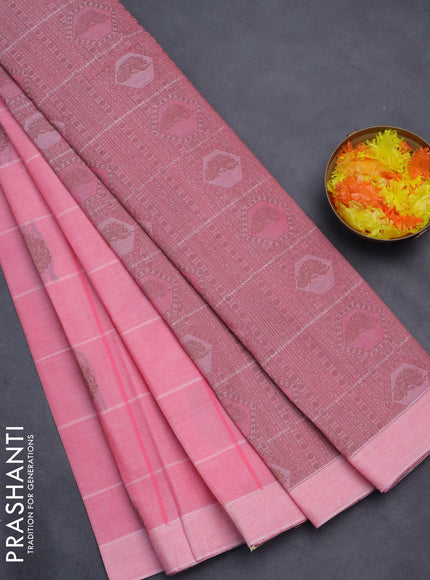 Nithyam cotton saree peach pink with allover checks & thread buttas in borderless style