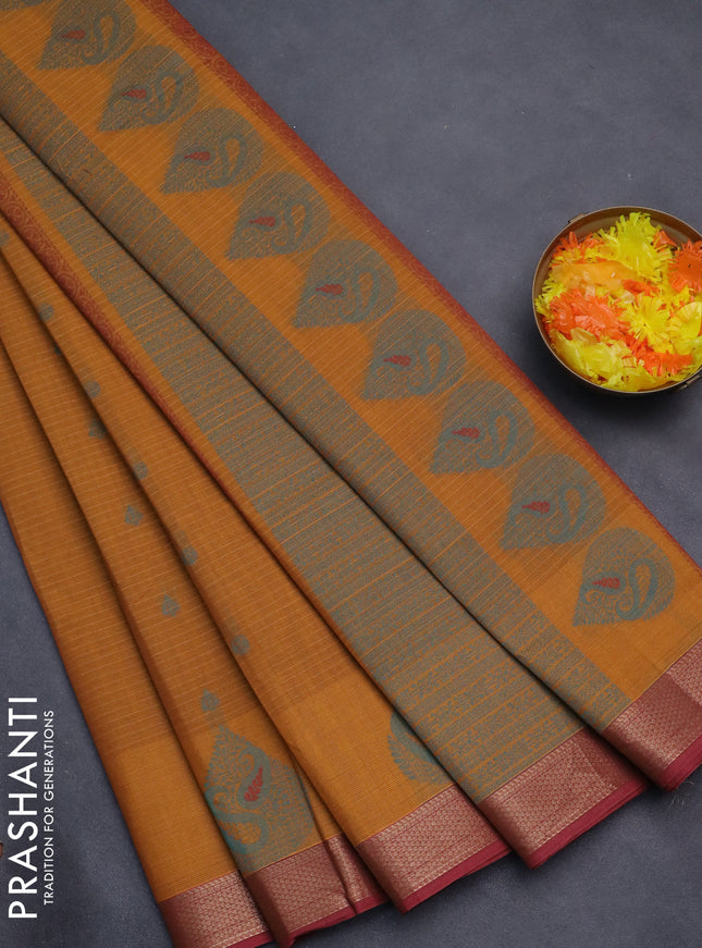 Nithyam cotton saree dark mustard and pink shade with allover checks & thread buttas and zari woven border