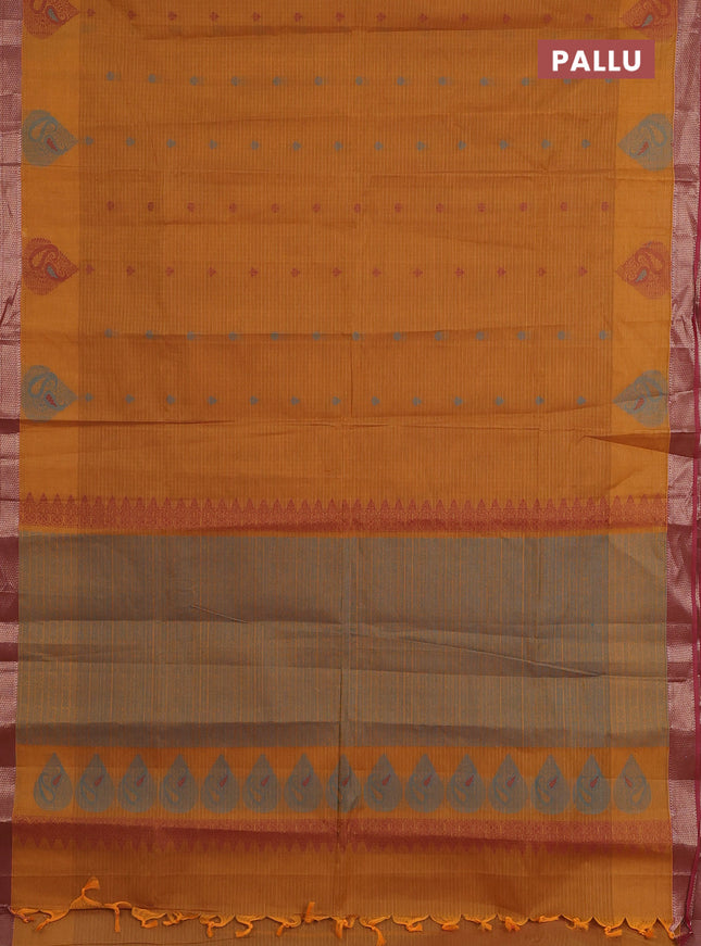Nithyam cotton saree dark mustard and pink shade with allover checks & thread buttas and zari woven border