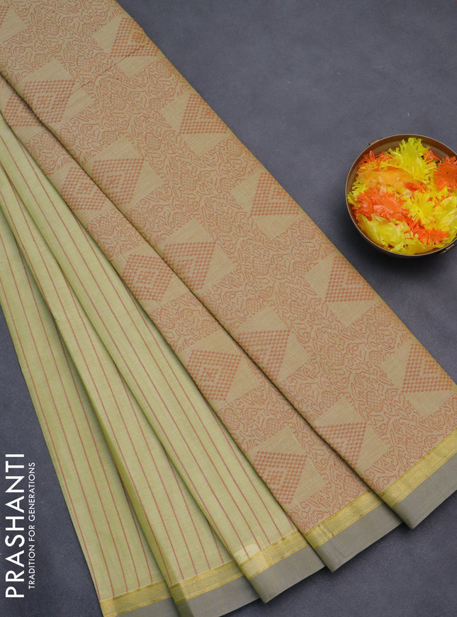 Nithyam cotton saree pista green and grey with allover thread weaves and zari woven simple border