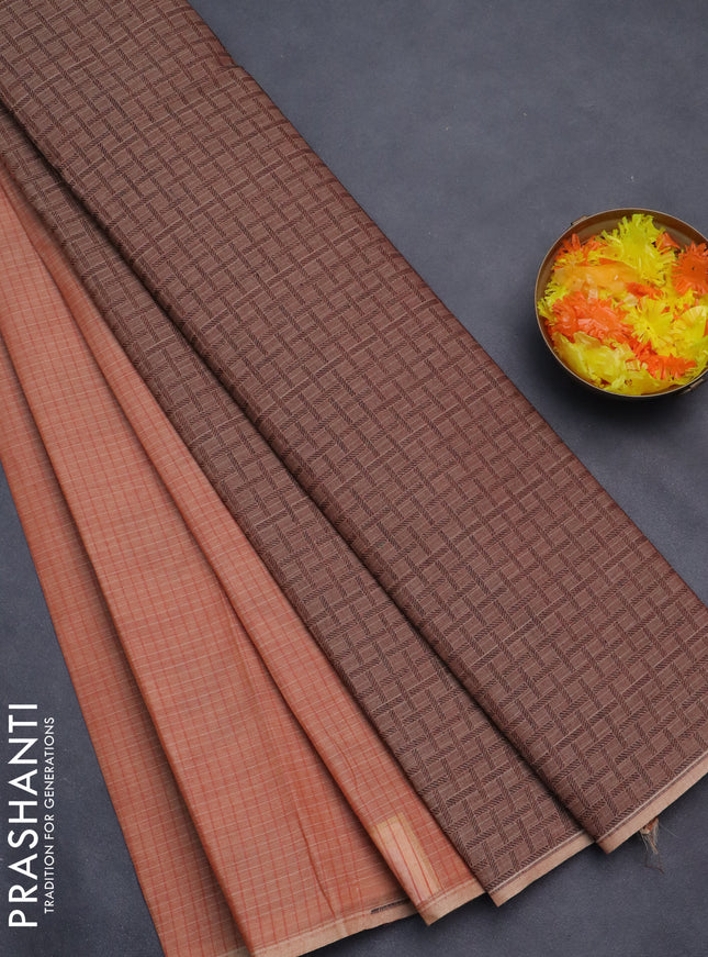 Nithyam cotton saree rust shade with allover thread checked pattern & buttas in borderless style