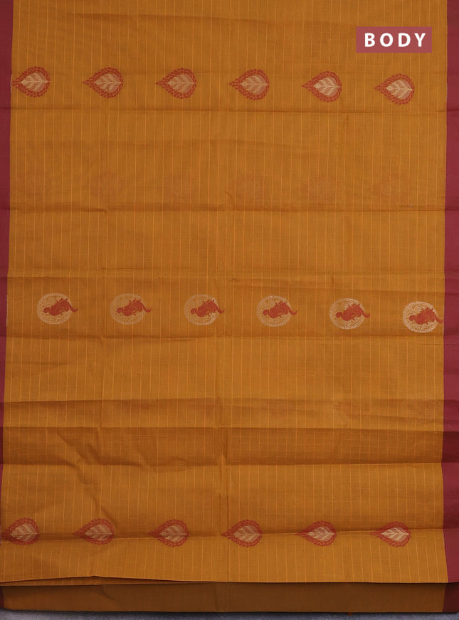 Nithyam cotton saree mustard yellow and maroon with allover thread weaves & zari buttas and simple border