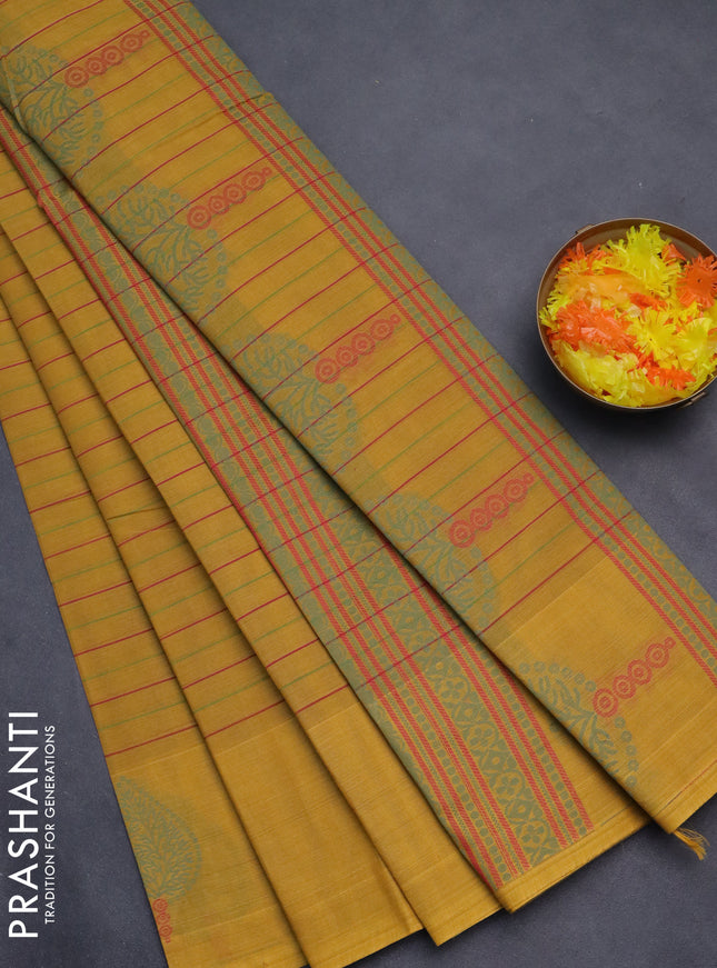 Nithyam cotton saree mustard yellow with allover stripe pattern and thread woven butta border