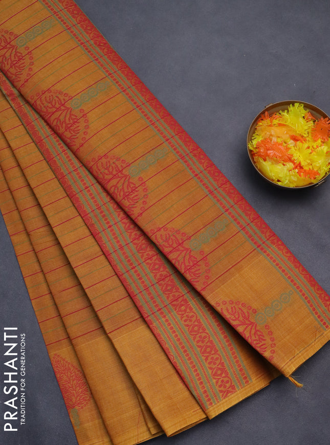 Nithyam cotton saree dark mustard with allover stripe pattern and thread woven butta border