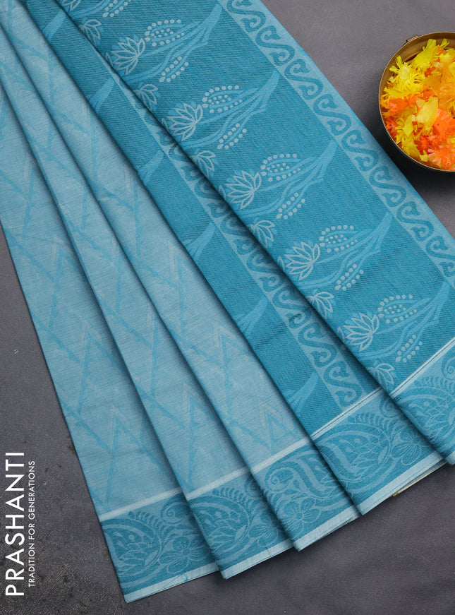 Coimbatore cotton saree teal blue with allover self emboss and thread woven border