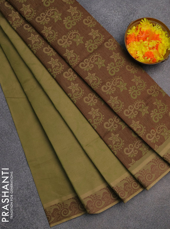 Coimbatore cotton saree sap green and coffee brown with allover self emboss and thread woven border