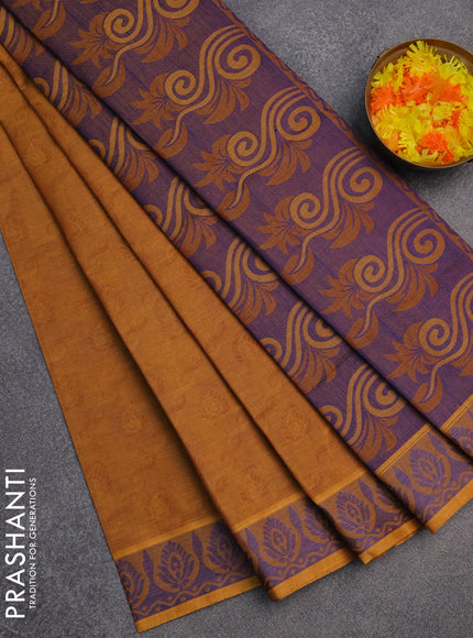 Coimbatore cotton saree dark mustard and blue with allover self emboss and thread woven border