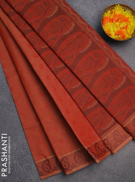 Coimbatore cotton saree rustic orange with allover self emboss and thread woven border