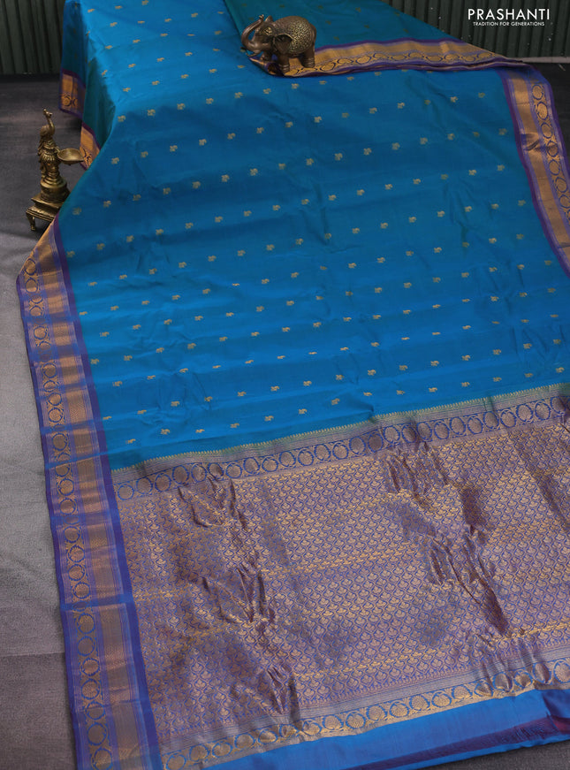 Gadwal silk cotton saree teal bluish green and purple with allover zari woven paisley buttas and zari woven border