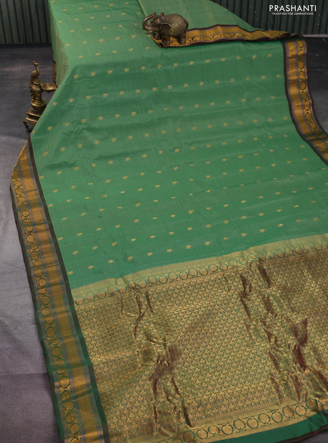 Gadwal silk cotton saree green shade and dual shade of greenish maroon with allover zari woven paisley buttas and zari woven border