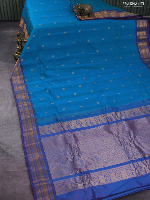 Gadwal silk cotton saree dual shade of bluish green and dual shade of maroon with zari woven buttas and zari woven border