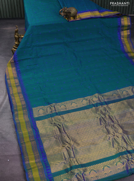 Gadwal silk cotton saree green and blue with allover checked pattern & thread buttas and zari woven border