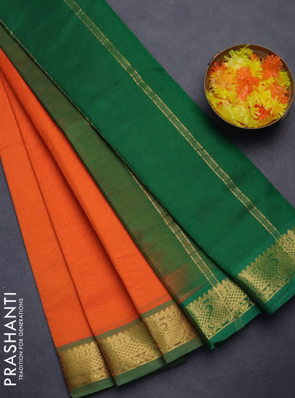 Silk cotton saree orange and green with plain body and zari woven border