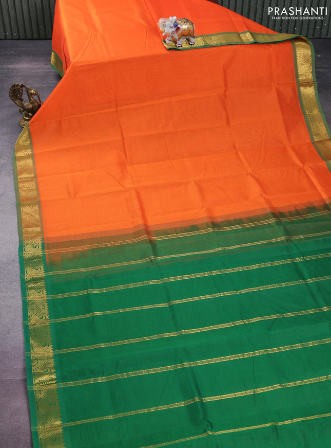 Silk cotton saree orange and green with plain body and zari woven border