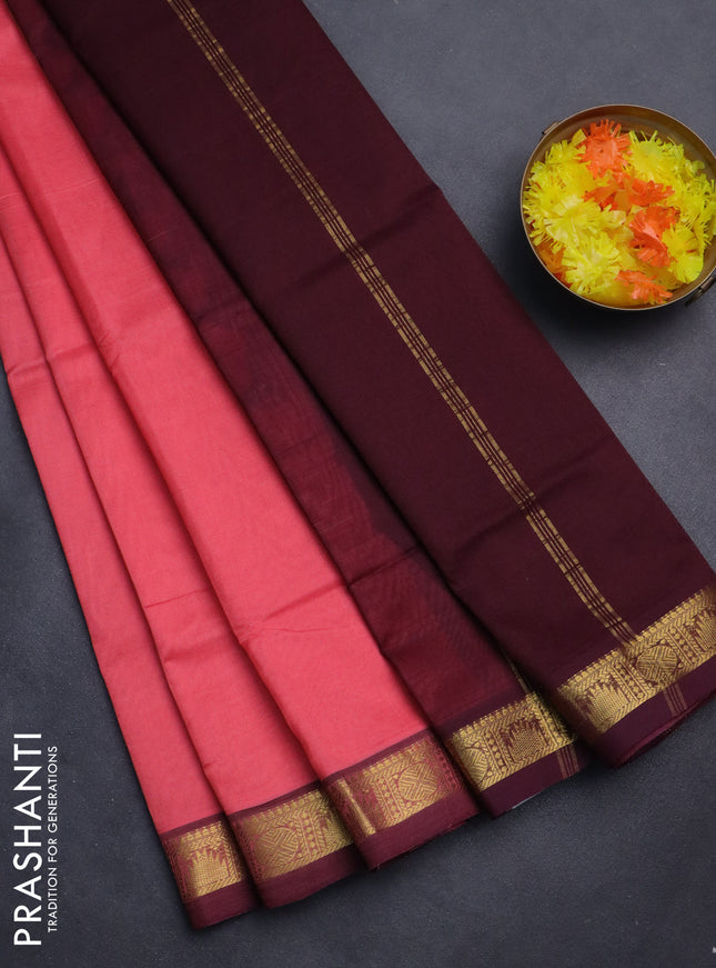 Silk cotton saree peach pink and deep maroon with plain body and zari woven border
