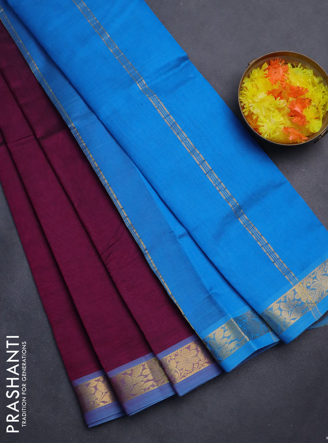 Silk cotton saree purple and cs blue with plain body and zari woven border