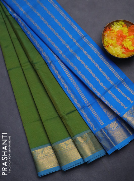 Silk cotton saree green and cs blue with plain body and zari woven border