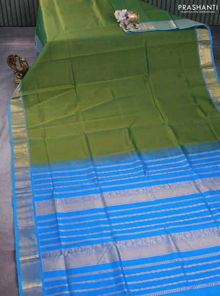 Silk cotton saree green and cs blue with plain body and zari woven border
