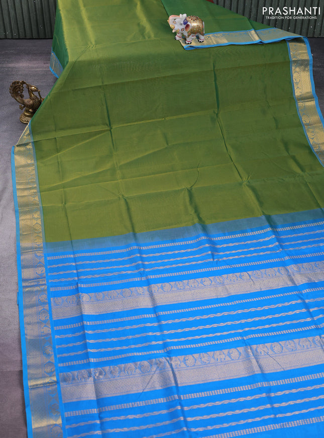 Silk cotton saree green and cs blue with plain body and zari woven border