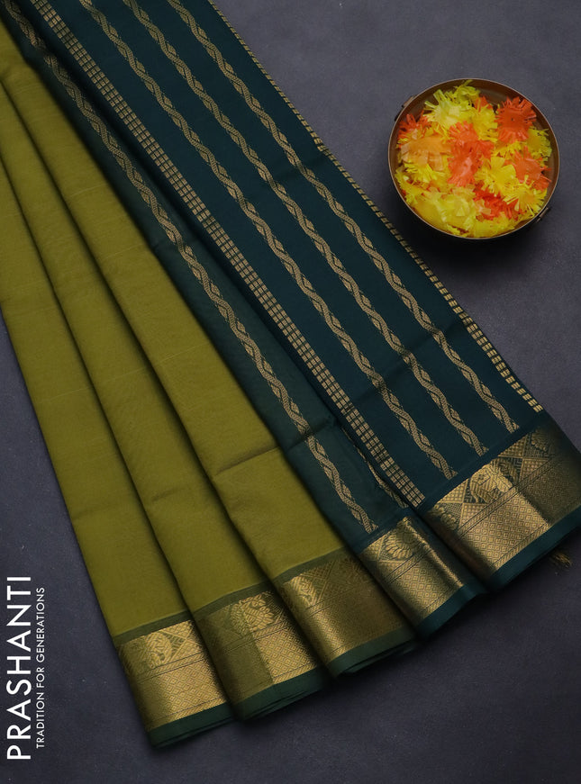 Silk cotton saree mehendi green and bottle green with plain body and zari woven border