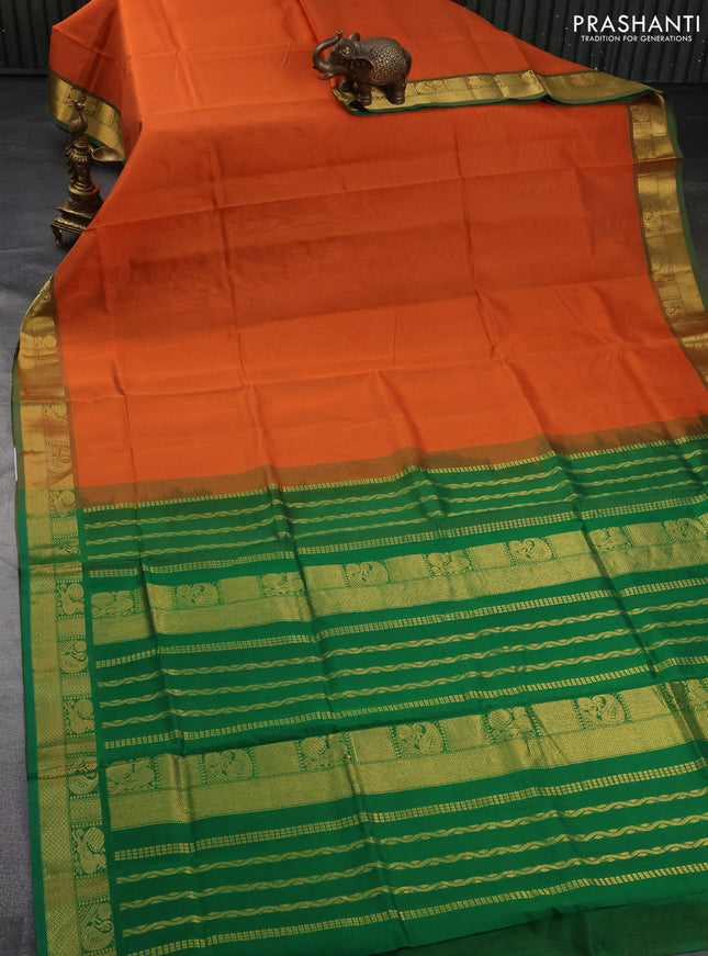 Silk cotton saree orange and green with plain body and zari woven border