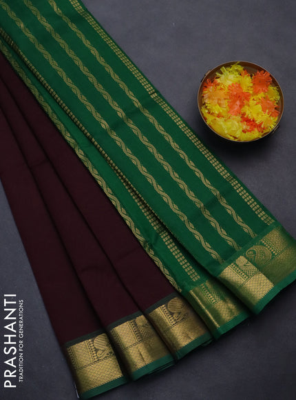 Silk cotton saree brown and green with plain body and zari woven border