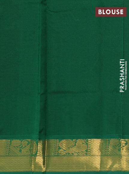 Silk cotton saree brown and green with plain body and zari woven border