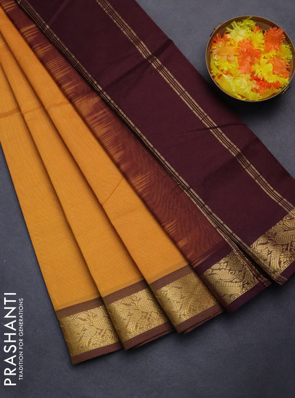 Silk cotton saree mango yellow and deep maroon with plain body and zari woven border