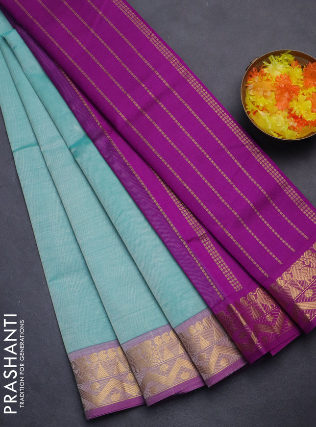 Silk cotton saree teal shade and purple with plain body and zari woven border