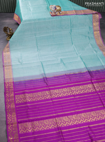 Silk cotton saree teal shade and purple with plain body and zari woven border