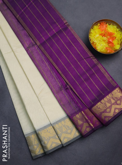 Silk cotton saree cream and purple with plain body and zari woven border