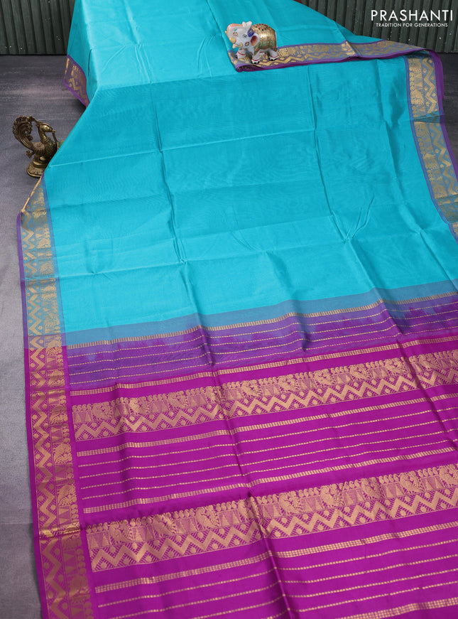 Silk cotton saree teal blue and purple with plain body and zari woven border