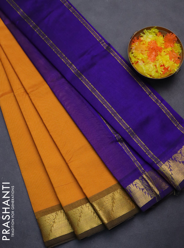 Silk cotton saree mango yellow and blue with plain body and zari woven border