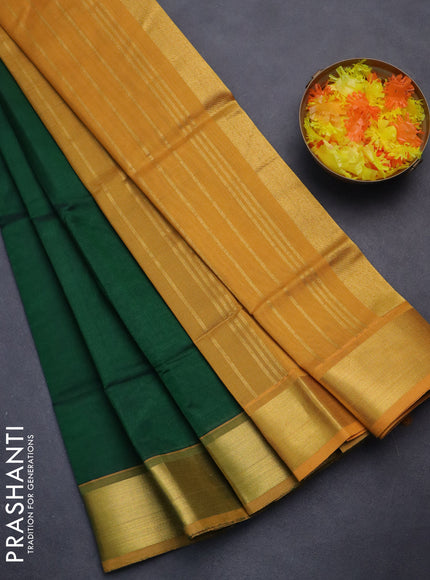 Silk cotton saree green and mustard yellow with plain body and zari woven border