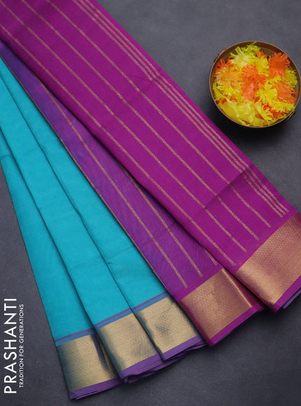 Silk cotton saree teal blue and purple with plain body and zari woven border