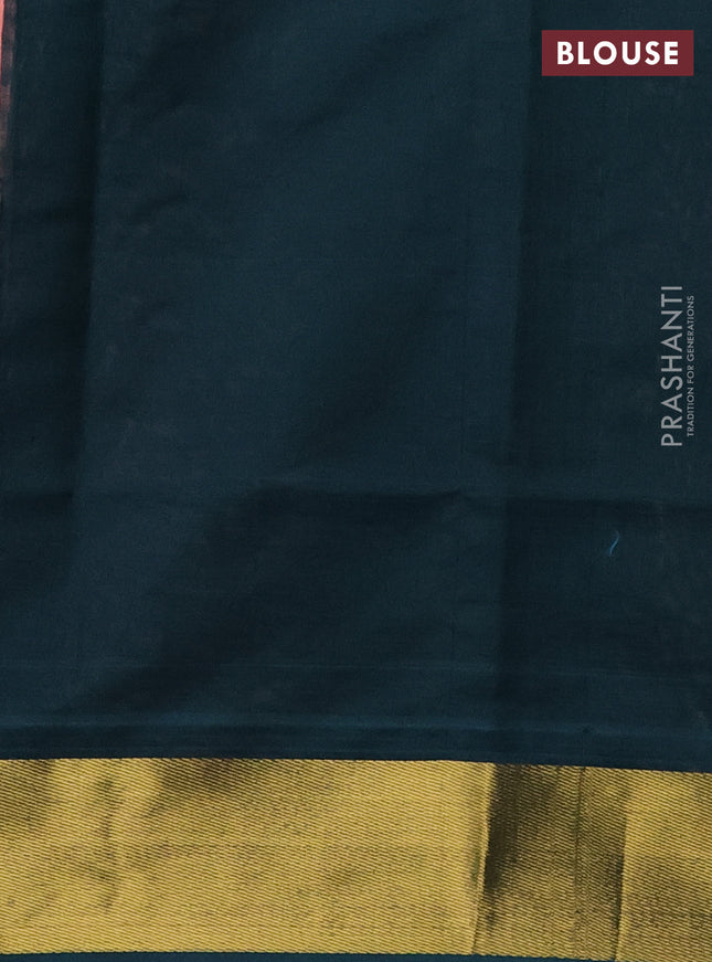 Silk cotton saree peach pink and bottle green with plain body and zari woven border