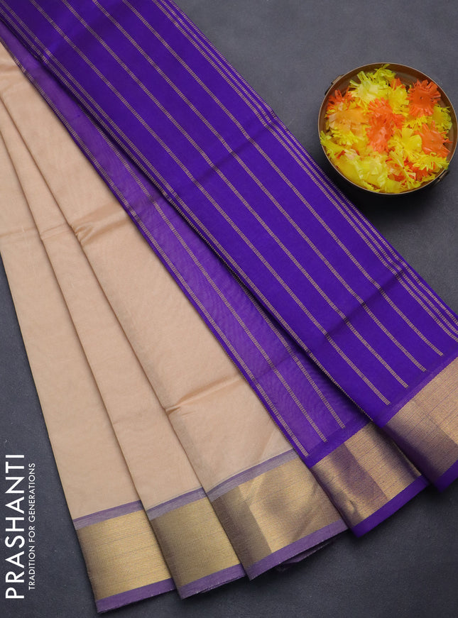 Silk cotton saree sandal and blue with plain body and zari woven border