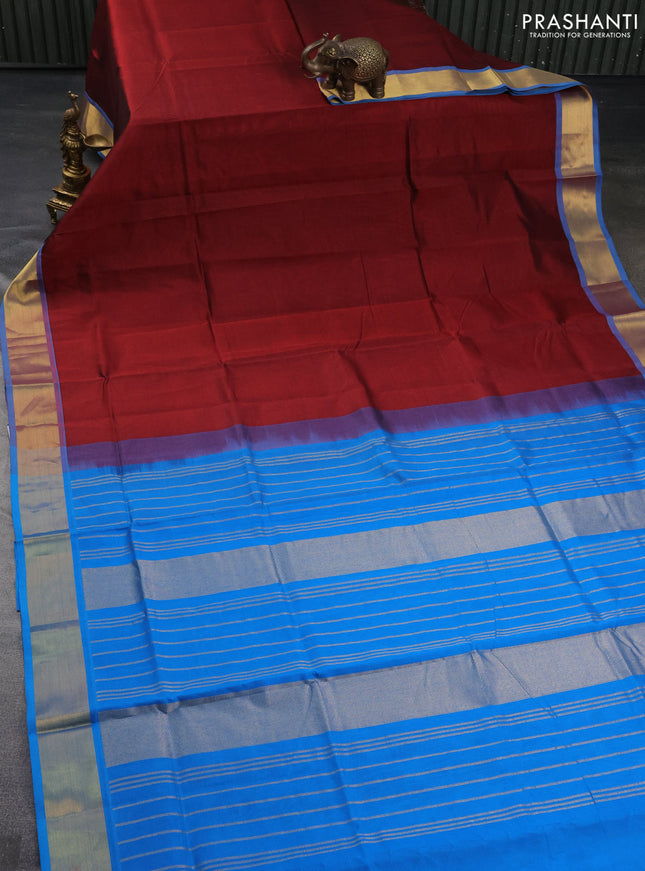 Silk cotton saree maroon and cs blue with plain body and zari woven border