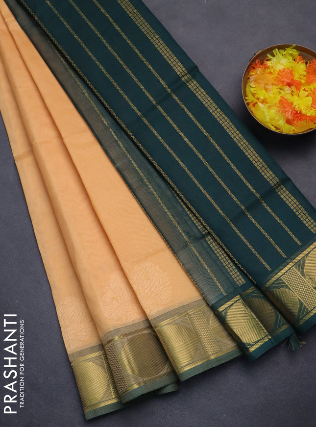 Silk cotton saree pale orange and green with plain body and rudhraksha zari woven border