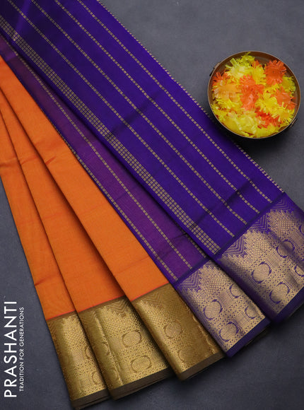 Silk cotton saree orange and blue with plain body and zari woven border