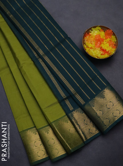 Silk cotton saree light green and green with plain body and zari woven border